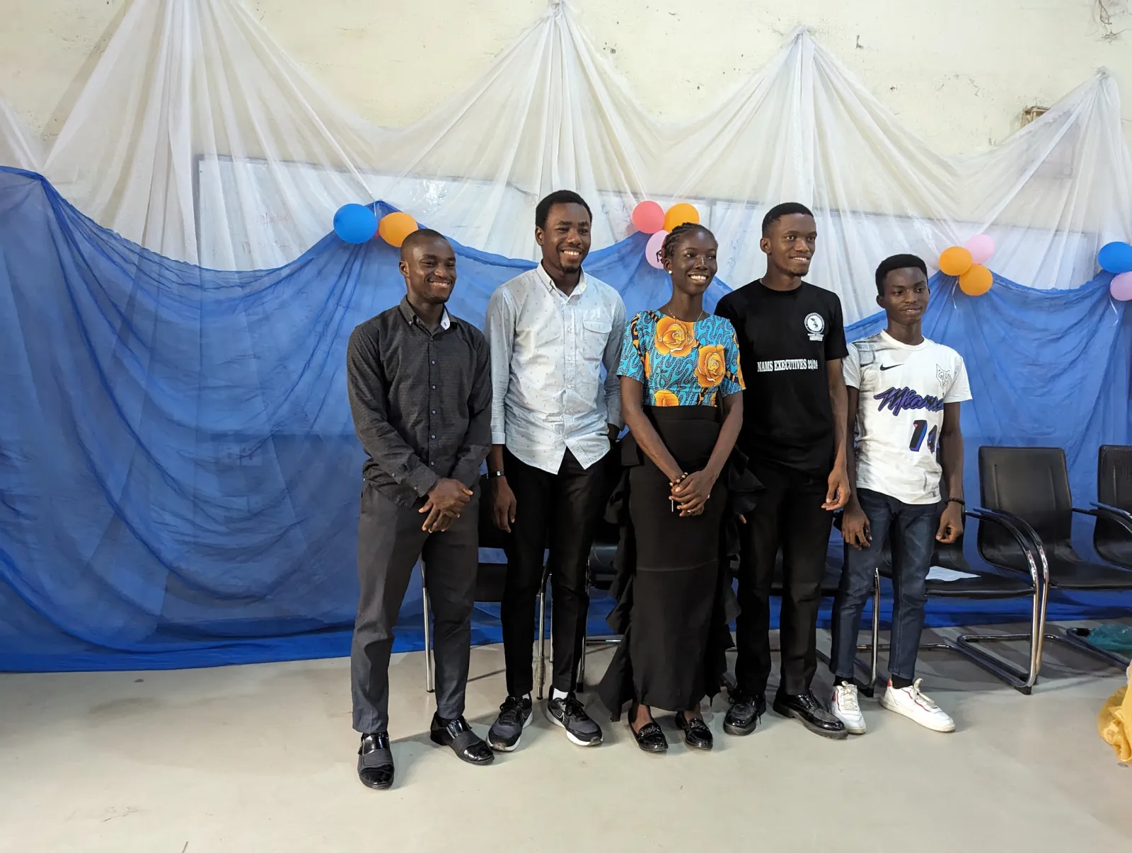 Tomiwa with fellow NAMS executives at a University of Lagos microbiology student event